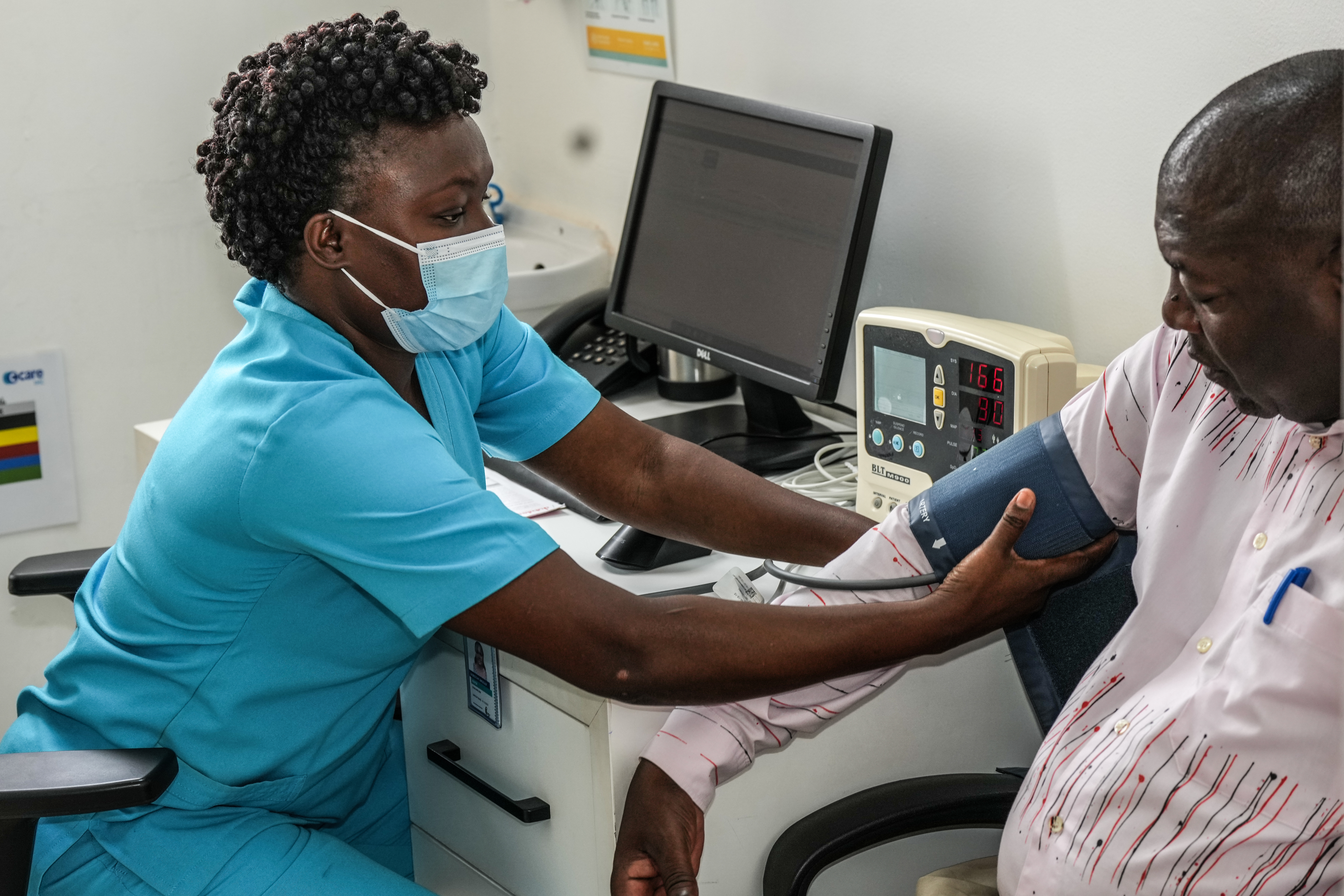 Healthcare administrator working at a computer