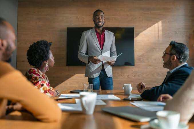 Business support lead presenting in a boardroom
